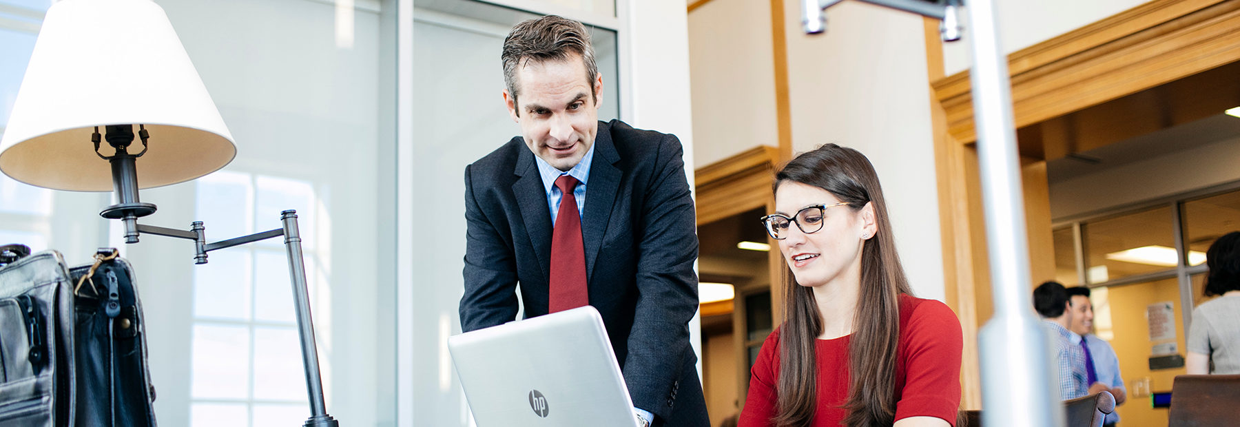 Section Image: Tyson Browning with female student looking at a laptop 
