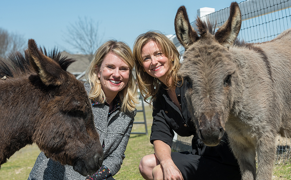 Shannon McLinden and Delia Faulk McLinden with donkeys