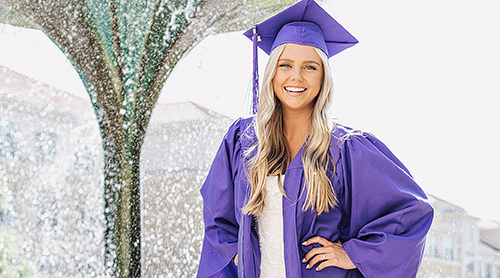 Section Image: Katrina Clough on the TCU sign 