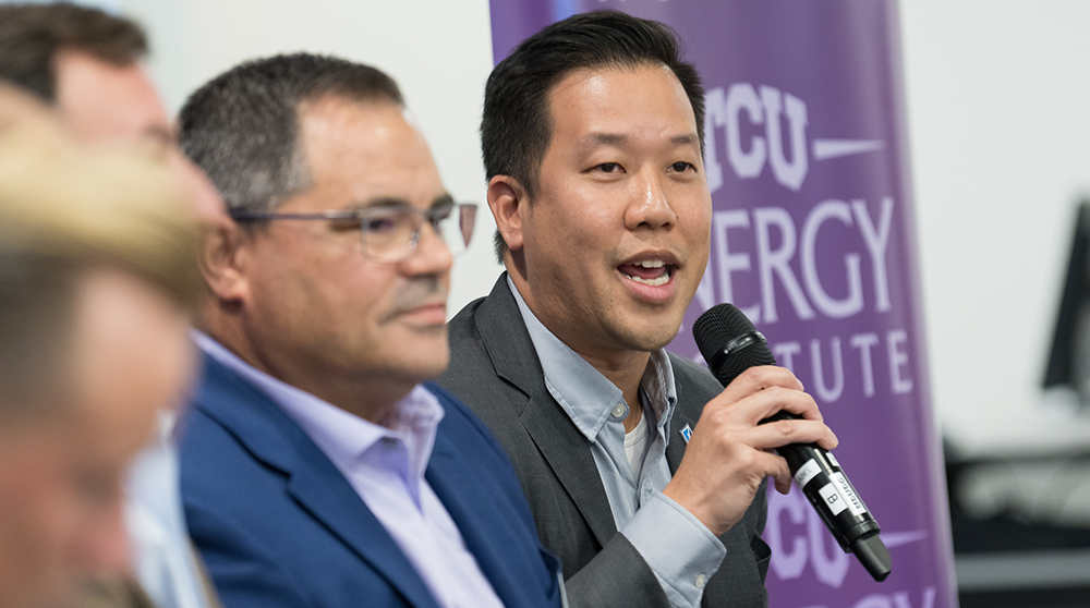 Derek Wong, alongside other panelists, addresses the Summit.