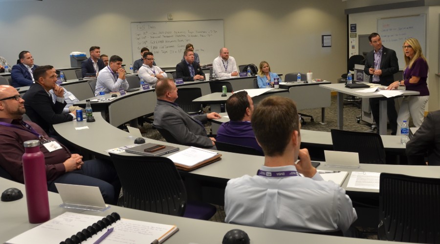 EMBA students in tiered classroom