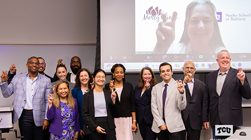 Section Image: Neeley MBA students with frogs up 