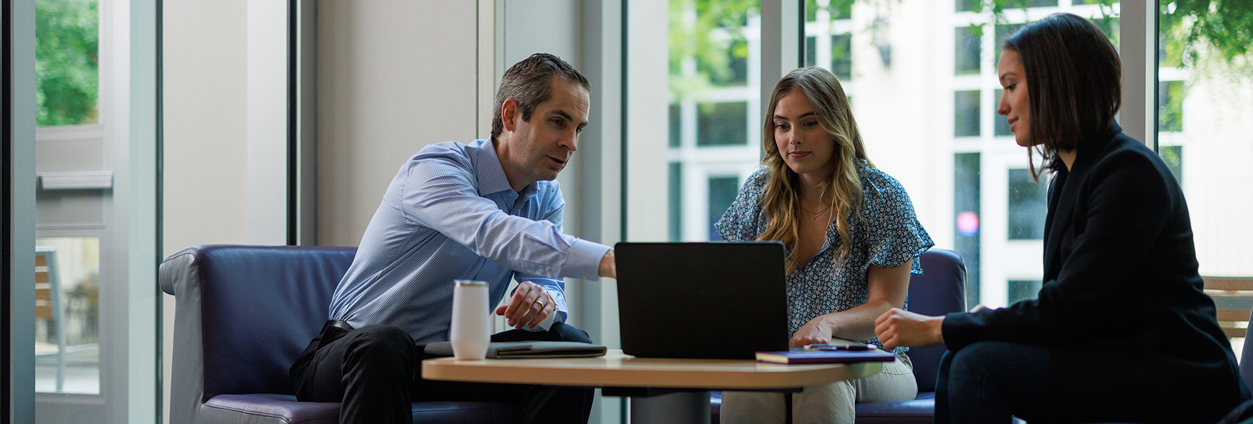 Section Image: Tyson Browning with two female students 