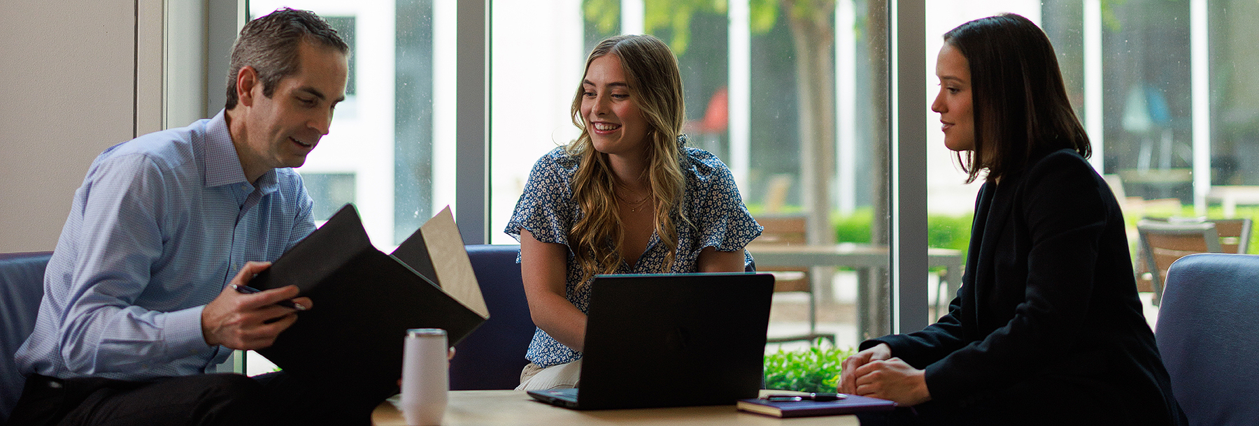 Section Image: Tyson Browning with two female students 