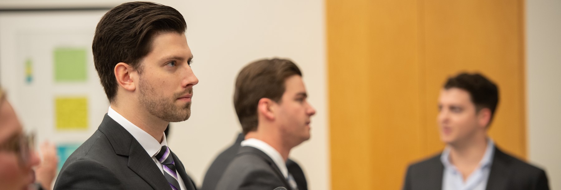 Section Image: Students in suits 