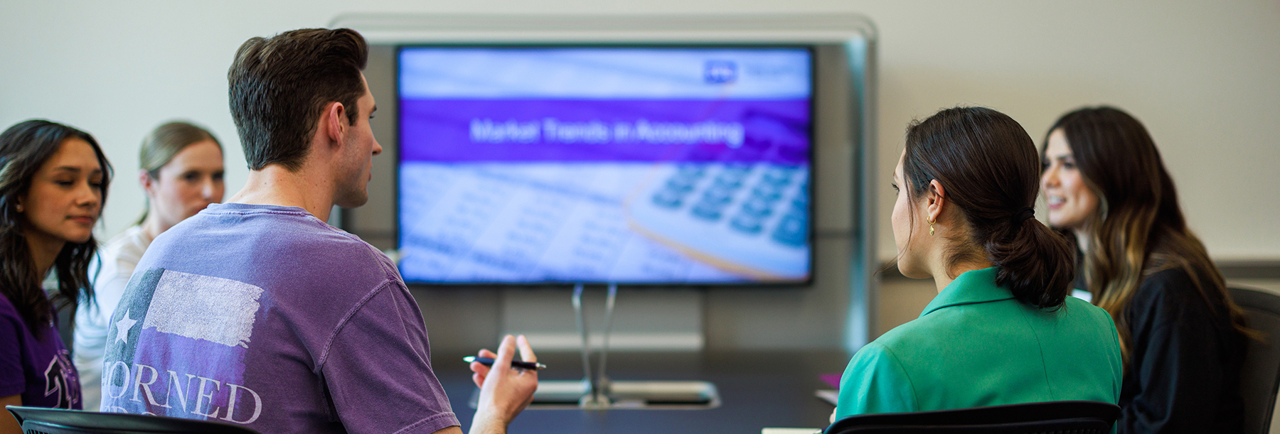 Section Image: Idea Factory student group collaborating at a table 