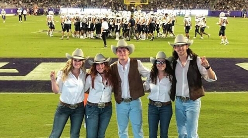 Section Image: Rangers with the Frog Flag on the field with the TCU band 