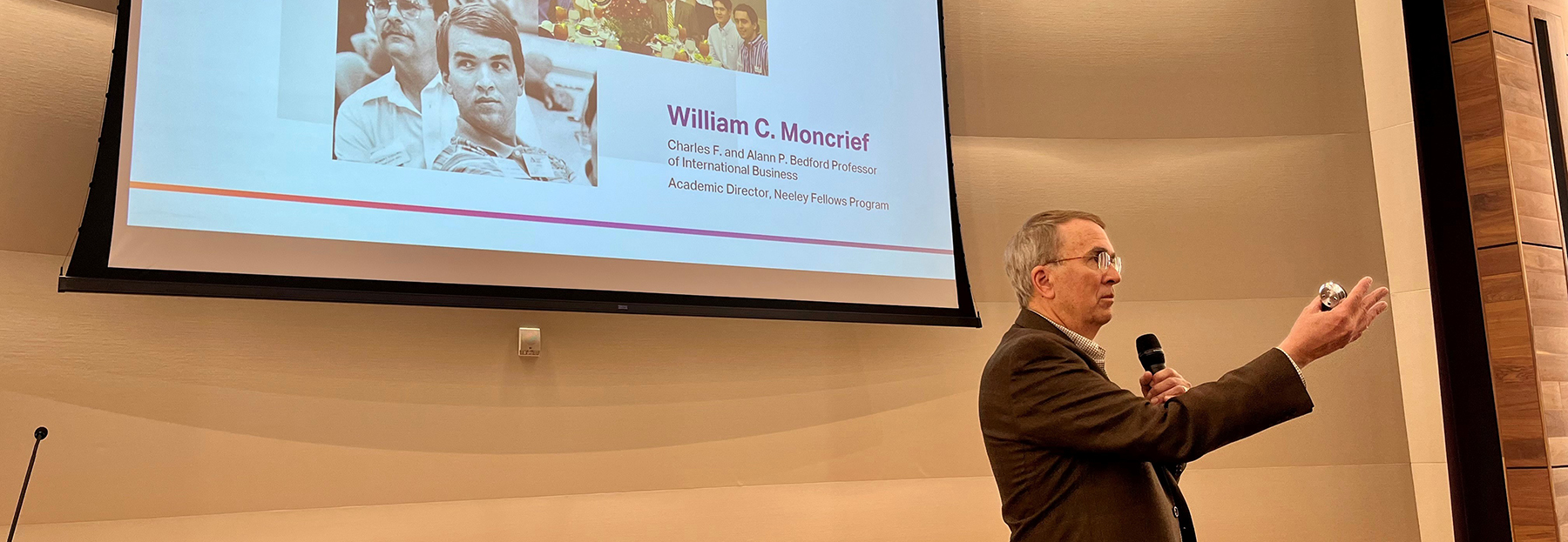 Section Image: Dr. Bill Moncrief lecturing about the Past, Present and Future of Neeley in Shaddock Auditorium 