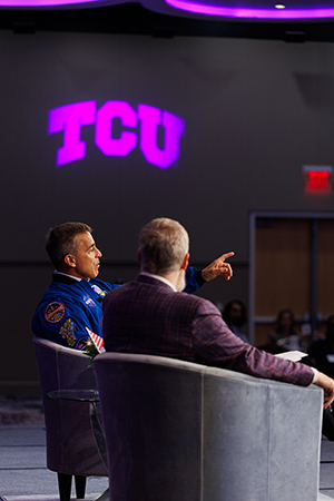 Chris Cassidy and Craig Crossland on stage with TCU on the wall