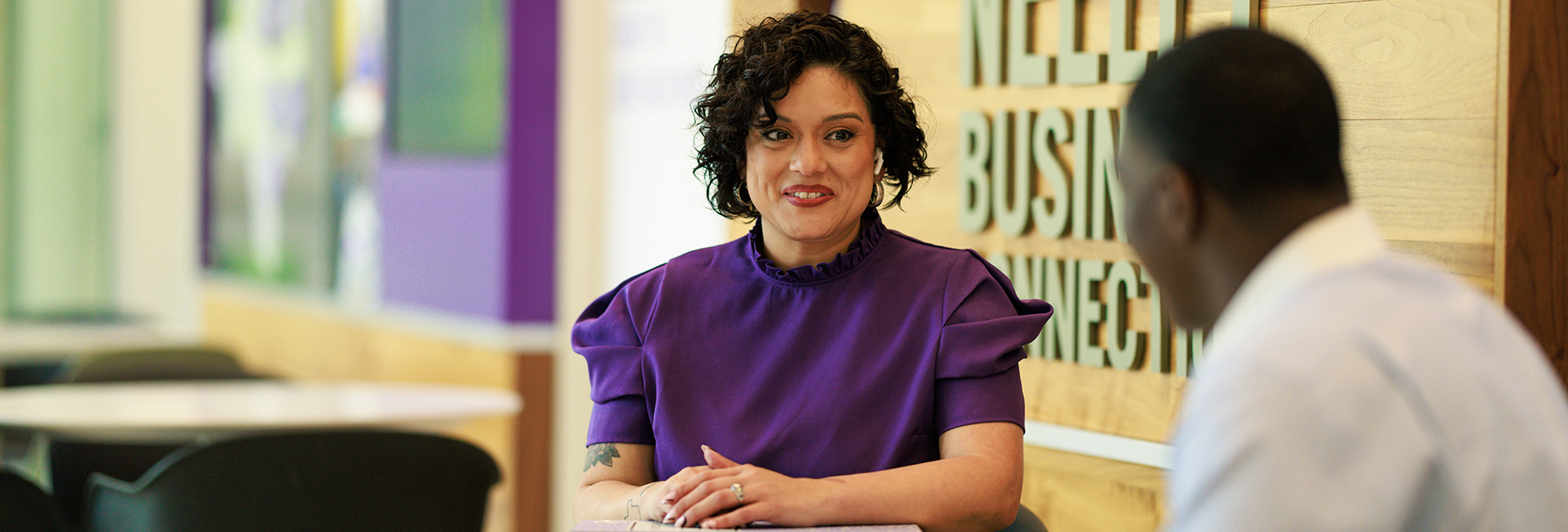 Section Image: Man and woman talking on the second floor of Hays 
