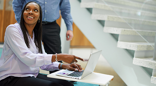 Michelle Franklin points to her laptop screen