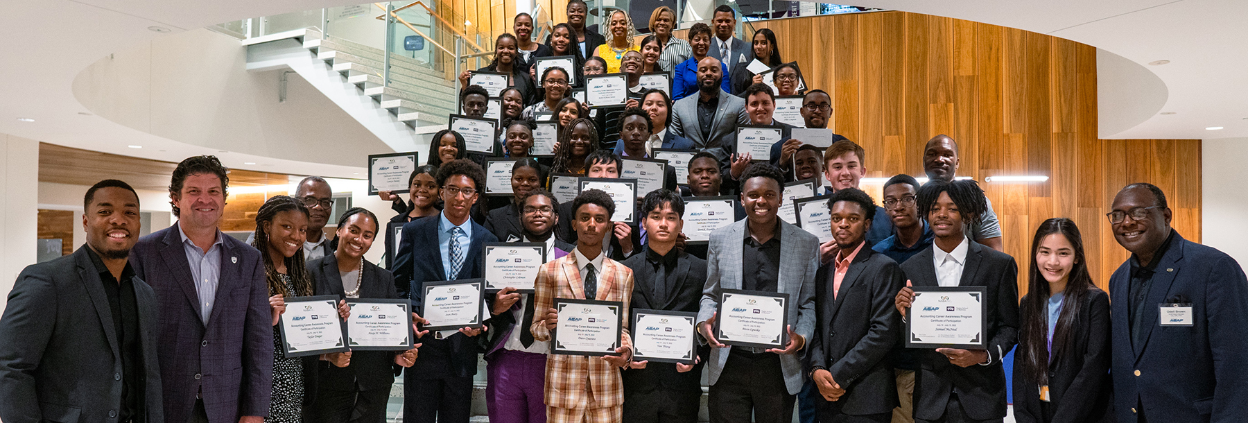 Section Image: ACAP students pose on the stairs in the Rogers Rotunda with their certificates. 