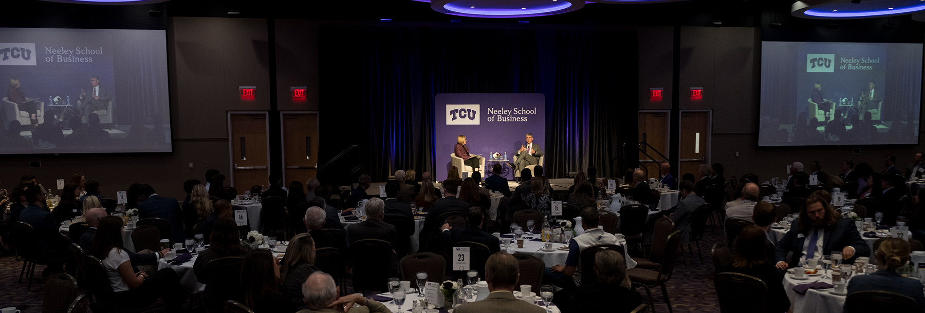 Section Image: Hettie Richardson and Grant Moise on stage in the BLUU ballroom for the TESS breakfast 