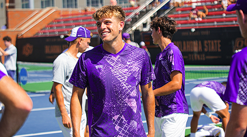 Luke Swan serving during a tennis match 
