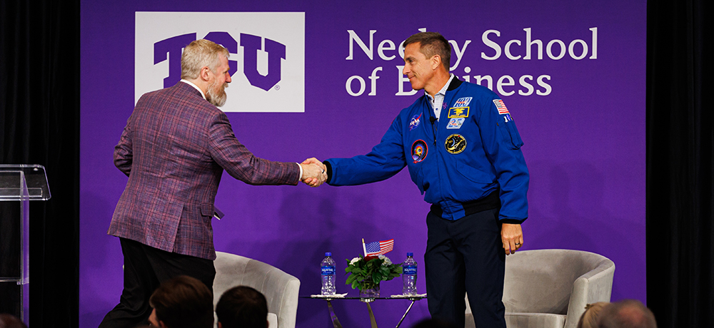 Craig Crossland shaking hands with Chris Cassidy