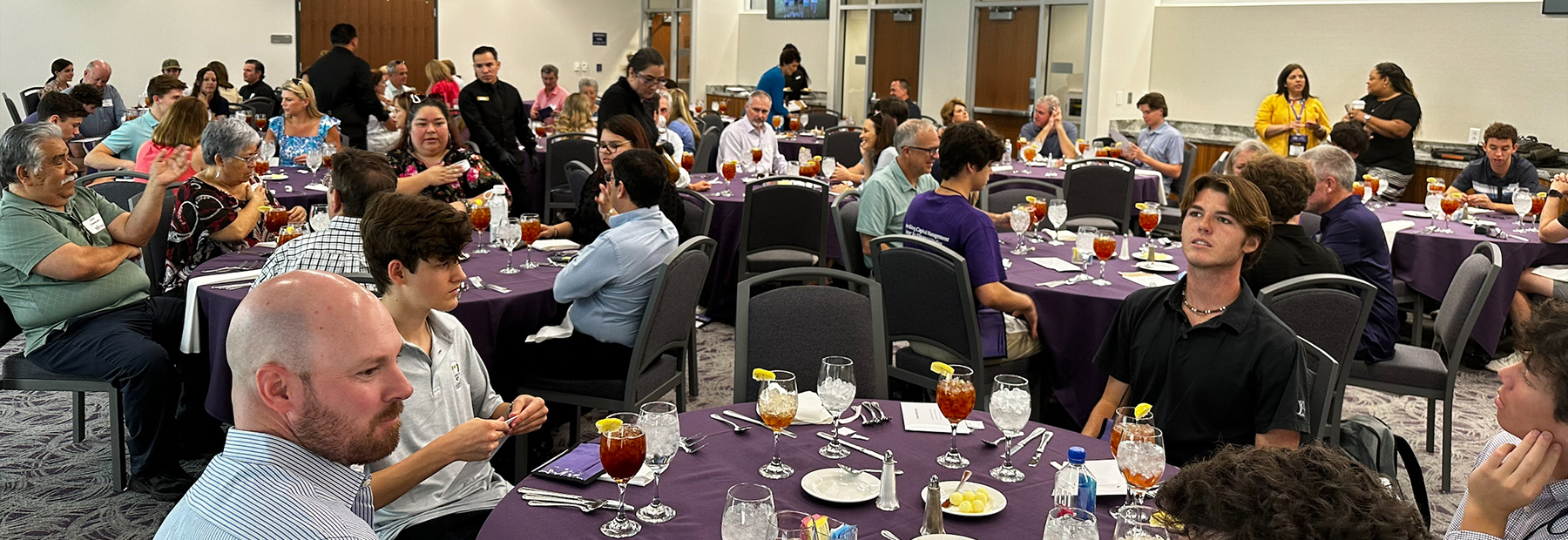 Section Image: Students and families gather for lunch during the High School Investor Challenge 