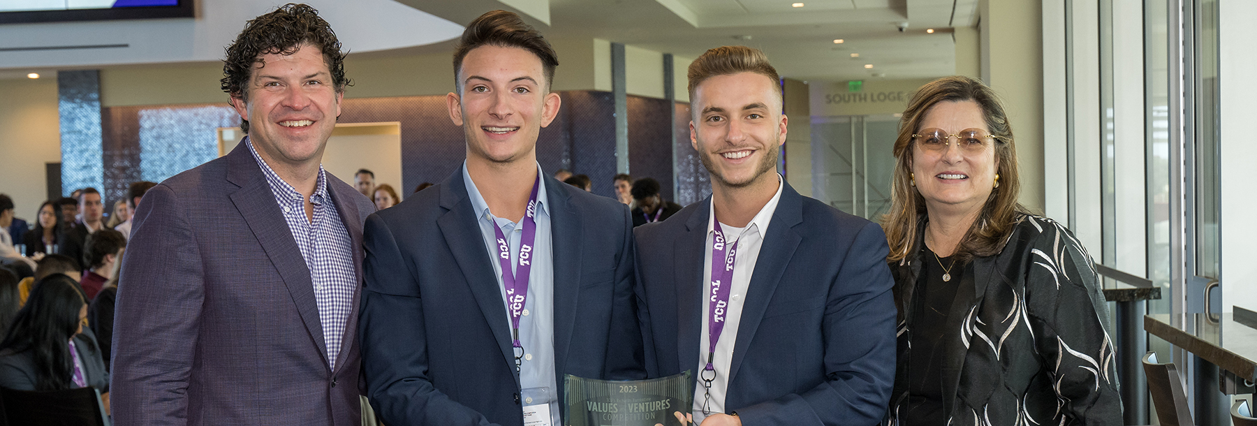 Section Image: The team from Rowan University posing with TCU President Daniel Pullin and competition founder, Nancy Richards. 