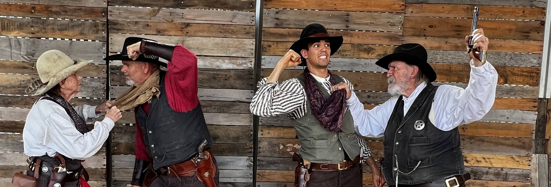 Section Image: Brendan Hartman with fellow cowboy actors 