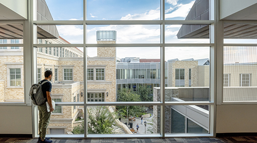 Section Image: Student looking at view of Neeley School of Business 