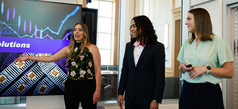 Section Image: Group of students presenting in the Rees Jones Incubator Lab 