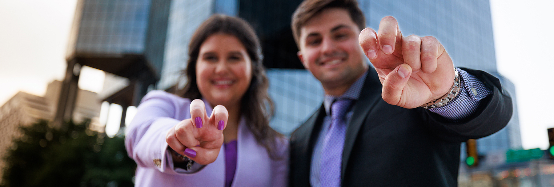 Section Image: Two students with frogs up downtown Fort Worth 