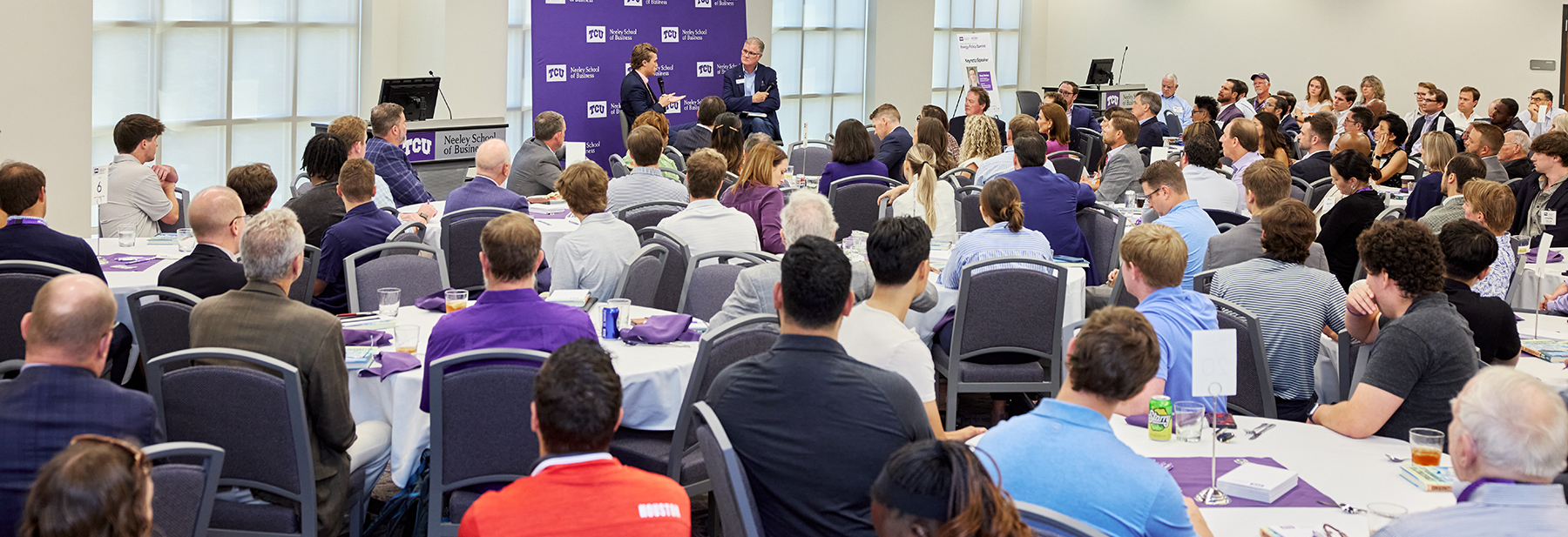 Section Image: Benji Backer and Michael Slattery on stage in the Hays Banquet Room during the Energy Summit 