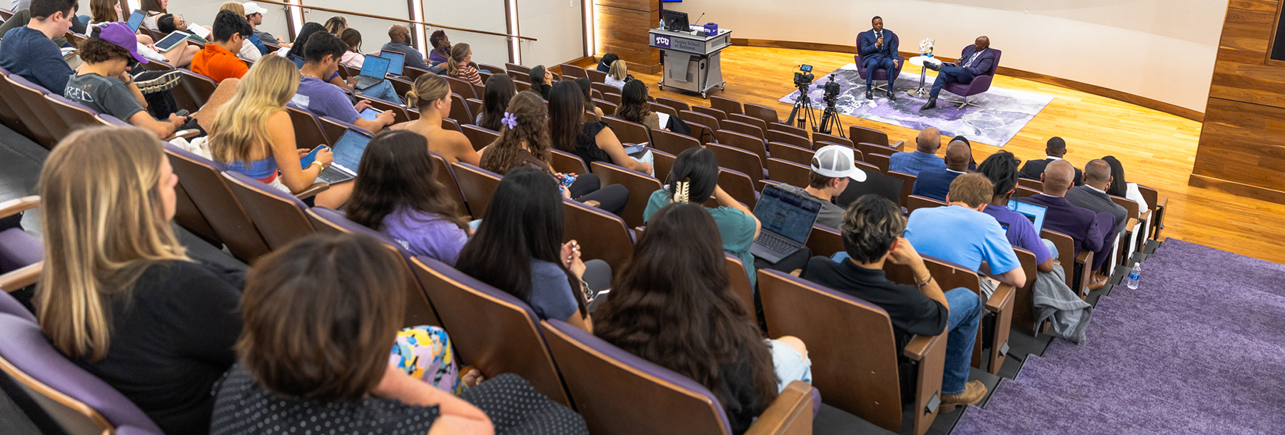 Section Image: Newy Scruggs and Anthony Kyles on the stage in the Shaddock Auditorium 