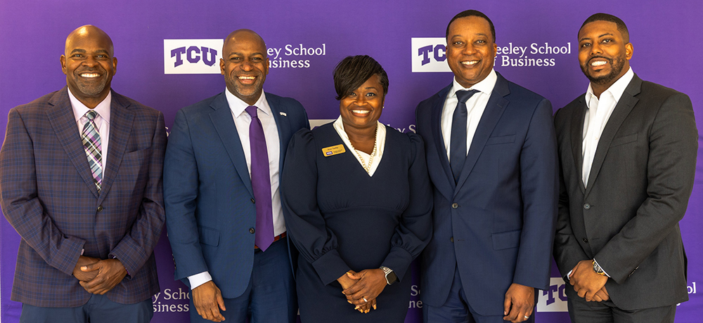 Newy Scruggs, Anthony Kyles and faculty and staff of the Neeley School