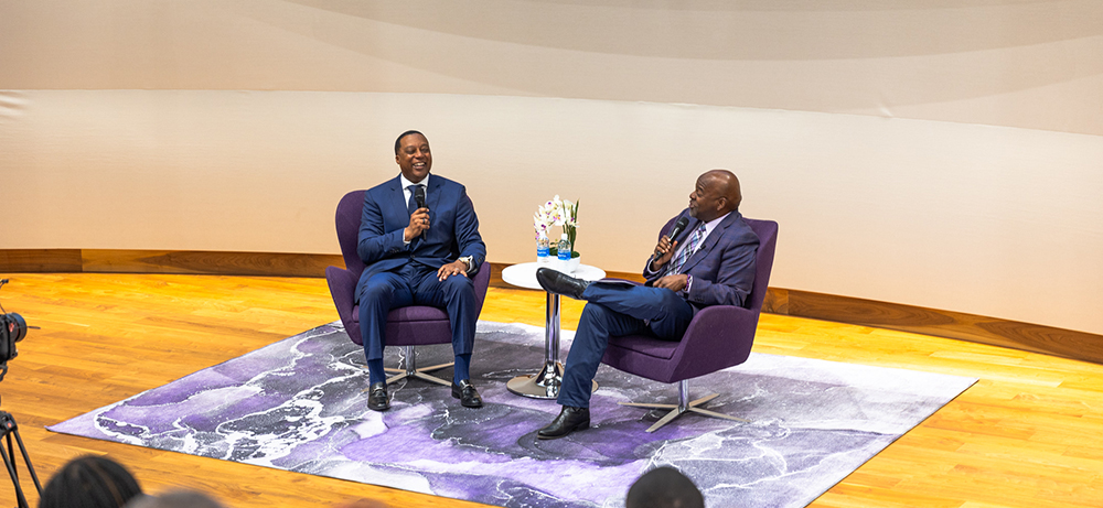 Anthony Kyles and Newy Scruggs on stage in the Shaddock Auditorium
