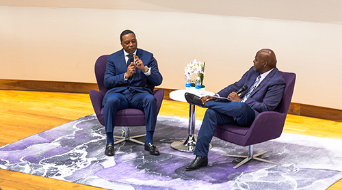 Section Image: Newy Scruggs and Anthony Kyles on the stage in the Shaddock Auditorium 